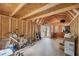 Spacious shed with a high ceiling, wooden beams, and ample room for storage and hobbies at 10502 Atlee St, New Port Richey, FL 34654