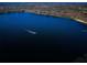 Scenic lake view with a boat creating ripples on the water at 10502 Atlee St, New Port Richey, FL 34654