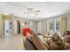 Bright and airy living room featuring light-colored flooring, a comfortable seating area, and natural light at 10502 Atlee St, New Port Richey, FL 34654