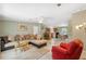 Inviting living room with a comfortable sectional sofa, opening to the kitchen and dining area for easy entertaining at 10502 Atlee St, New Port Richey, FL 34654