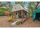 Charming outbuilding with a covered porch, perfect for a guest house or studio at 10502 Atlee St, New Port Richey, FL 34654