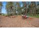 A spacious community playground with mature trees and a picnic shelter nearby at 10502 Atlee St, New Port Richey, FL 34654