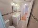 Well-lit bathroom features a modern vanity, stylish mirror and tiled walls with decorative accents at 11625 Constance Dr, Port Richey, FL 34668