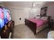 Bedroom features a double bed, closet, and dresser for storage at 11625 Constance Dr, Port Richey, FL 34668