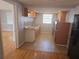 Clean kitchen features tile flooring, ample counter space, updated cabinetry, and stainless appliances at 11625 Constance Dr, Port Richey, FL 34668