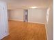 Spacious open-concept living area with hardwood floors and neutral paint, offering a versatile living space at 11625 Constance Dr, Port Richey, FL 34668