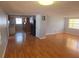 Inviting living room with hardwood floors and a view into the kitchen at 11625 Constance Dr, Port Richey, FL 34668