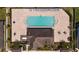 Aerial view of neighborhood pool with many chairs and tables with clean, clear water at 11760 Winterset Cove Dr, Riverview, FL 33579