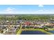 Aerial view of the neighborhood showing the lake and the surrounding area at 11760 Winterset Cove Dr, Riverview, FL 33579