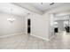 Open-concept dining room features ceramic tile floors and modern chandelier lighting at 11760 Winterset Cove Dr, Riverview, FL 33579