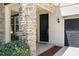 Beautiful front door with stone accents, covered porch, and well maintained landscaping at 11760 Winterset Cove Dr, Riverview, FL 33579