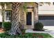 Beautiful front door with stone accents, covered porch, and well maintained landscaping at 11760 Winterset Cove Dr, Riverview, FL 33579