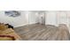 Open living room featuring hardwood floors and comfortable seating, ideal for entertaining and relaxing at 11760 Winterset Cove Dr, Riverview, FL 33579