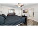 Comfortable main bedroom featuring a ceiling fan, dresser, and wall-mounted television at 11760 Winterset Cove Dr, Riverview, FL 33579