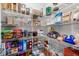 Walk-in pantry featuring wire shelving fully stocked with a variety of dry goods and household supplies at 11760 Winterset Cove Dr, Riverview, FL 33579