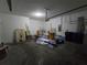 A basement with cement flooring and a variety of household materials at 11839 Cross Vine Dr, Riverview, FL 33579