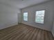 A clean and bright bedroom with laminate flooring and natural light at 11839 Cross Vine Dr, Riverview, FL 33579