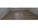 Bedroom with wood laminate flooring and window with blinds at 11839 Cross Vine Dr, Riverview, FL 33579