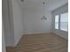 Dining room featuring light-colored wood flooring, neutral paint, and abundant natural light at 11839 Cross Vine Dr, Riverview, FL 33579