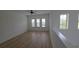Upstairs loft with wood floors, neutral paint, lots of natural light from several windows, and white walls at 11839 Cross Vine Dr, Riverview, FL 33579