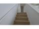 View up staircase with wood stairs, white walls, and handrail leading to the upper level at 11839 Cross Vine Dr, Riverview, FL 33579