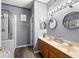 Bathroom features dual sinks, wood-look floors, and a separate tiled shower and tub at 12008 Fern Blossom Dr, Gibsonton, FL 33534