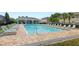 A luxurious pool with lounge chairs and covered lounge area at 12008 Fern Blossom Dr, Gibsonton, FL 33534