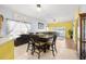 View of the dining area with access to the backyard with pool, perfect for outdoor living at 12008 Fern Blossom Dr, Gibsonton, FL 33534