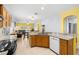 Open kitchen with granite counters overlooks living area, creating a seamless living space at 12008 Fern Blossom Dr, Gibsonton, FL 33534