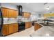 Updated kitchen with stainless steel appliances, tile backsplash, and granite countertops at 12008 Fern Blossom Dr, Gibsonton, FL 33534