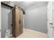 Laundry room features wood cabinet for storage and easy access to utilities at 12008 Fern Blossom Dr, Gibsonton, FL 33534