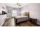 Comfortable main bedroom with wood-look floors and a relaxing ambiance at 12008 Fern Blossom Dr, Gibsonton, FL 33534