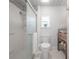 Modern bathroom featuring a walk-in shower, stylish fixtures, and a window for natural light at 1211 E Park Cir, Tampa, FL 33604