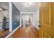 Inviting entryway featuring hardwood floors and an open floor plan leading to the dining area at 1211 E Park Cir, Tampa, FL 33604