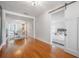 Bright living room showcasing an open layout connecting to a bedroom through a sliding barn door at 1211 E Park Cir, Tampa, FL 33604