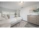 Comfortable main bedroom with neutral tones, wood-look floors, and natural light at 1211 E Park Cir, Tampa, FL 33604