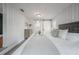 Bright main bedroom with stylish decor, wood paneling, and a convenient ensuite at 1211 E Park Cir, Tampa, FL 33604