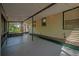 A screened porch area with string lights overhead at 1211 E Park Cir, Tampa, FL 33604