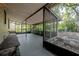 A screened back porch area with string lights at 1211 E Park Cir, Tampa, FL 33604