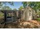 Cozy screened porch attached to the house, providing a comfortable outdoor living space at 1211 E Park Cir, Tampa, FL 33604