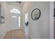 Welcoming entryway features a modern door, arched window, and elegant decor at 12408 Seabrook Dr, Tampa, FL 33626