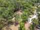 Secluded home nestled among mature trees offering privacy and a long driveway at 12514 Avery Rd, Thonotosassa, FL 33592