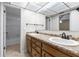 Bathroom featuring double sinks, granite countertop, and a mirrored ceiling at 12514 Avery Rd, Thonotosassa, FL 33592