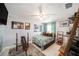 Cozy bedroom with a ceiling fan, neutral walls, and tile floors at 135 Rodney Ct, Palm Harbor, FL 34684