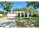 Charming single-story home with a well-maintained lawn and a classic white exterior at 135 Rodney Ct, Palm Harbor, FL 34684