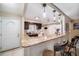 Bright kitchen with granite countertops, a breakfast bar, and plenty of cabinet space at 135 Rodney Ct, Palm Harbor, FL 34684