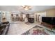 Well-lit living room showcasing tile floors and open access to the kitchen and dining areas at 135 Rodney Ct, Palm Harbor, FL 34684