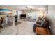 Comfortable living room with tile flooring, ceiling fan, and a sliding glass door at 135 Rodney Ct, Palm Harbor, FL 34684