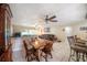 Spacious living area featuring tile flooring, a ceiling fan, and a view of the backyard at 135 Rodney Ct, Palm Harbor, FL 34684