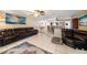 Spacious living room featuring tile floors, ceiling fans, and an open floor plan at 135 Rodney Ct, Palm Harbor, FL 34684